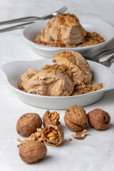 two portions of walnut ice cream