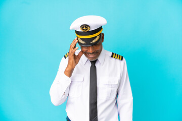 Airplane pilot senior man isolated on blue background laughing