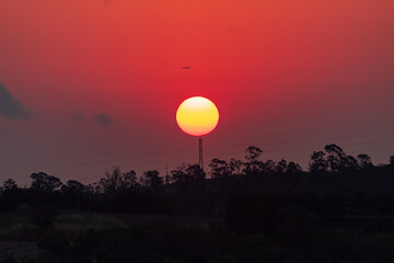 Obraz premium sunset over the mountains and airplane