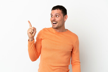 Fototapeta premium Brazilian man over isolated white background intending to realizes the solution while lifting a finger up
