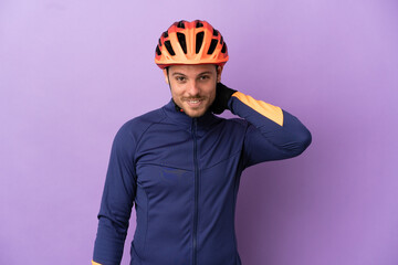 Young Brazilian cyclist man isolated on purple background laughing - obrazy, fototapety, plakaty