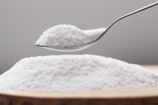 Spoon with natural sweetener stevia on a heap