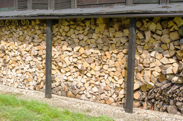 Collection stacked firewood outside for the fireplace
