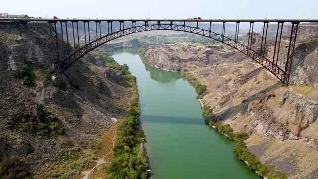 Aerial view of the Perrine Memorial Bridge over the snake river in Twin Falls, Idaho. With cars driving across the bridge.