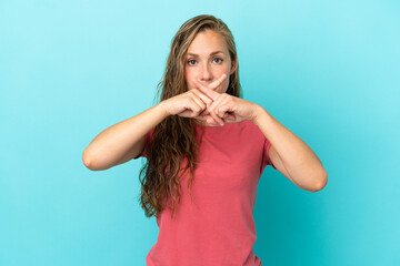 Young caucasian woman isolated on blue background showing a sign of silence gesture