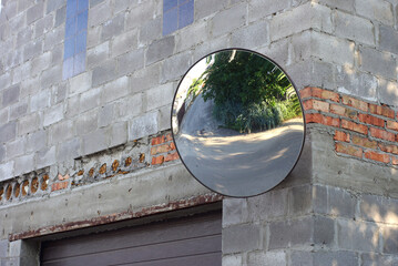 mirror corner brick house reflects the street