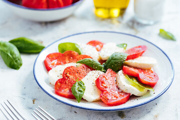 Mozzarella and tomato salad with basil, olive oil and ciabatta bread