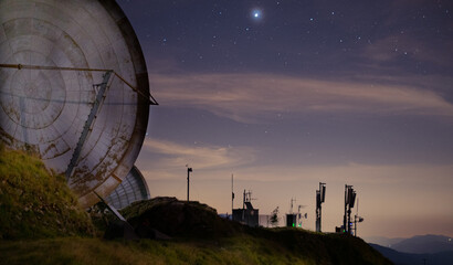 NATO satellite dishes with starry sky and planet Jupiter © Marco Bonomo