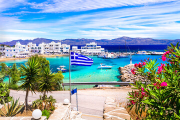 Greece holidays, Cyclades, Paros island beaches and sea. Scenic tranquil coastal village Piso Livadi with turquoise sea - obrazy, fototapety, plakaty