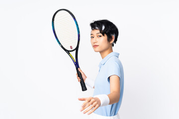 Young Vietnamese tennis player woman over isolated white wall playing tennis