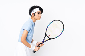 Young Vietnamese tennis player woman over isolated white wall playing tennis