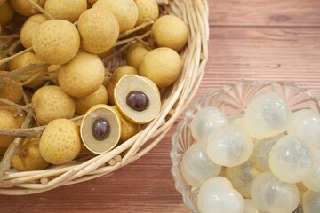 Ripe longan on an old wooden background.