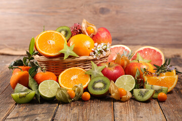 assorted of fresh fruit with orange, kiwi, apple and pomegranate