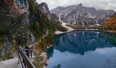 Walk around the Braies lake. Lago di Braies (Pragser Wildsee) is a wild lake in the Dolomites in South Tyrol, Italy.