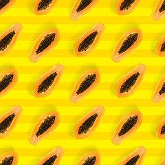Fresh ripe papaya seamless pattern on yellow background. Tropical abstract background. Top view. Creative design, minimal flat lay concept. Trend tropical fruit food background pattern