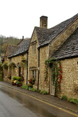 Fototapeta na wymiar Historic homes covered in ivy in Castle Combe, England