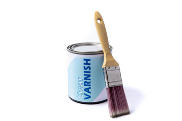 A generic labelled quart or liter can of varnish with a paint brush leaning on it isolated on white