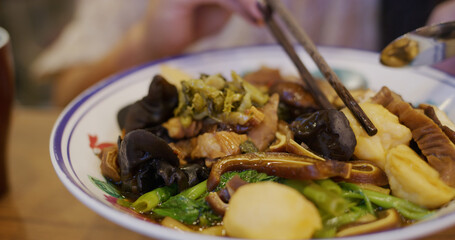 Woman eat her noodle in restaurant
