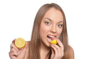 Portrait of beautiful young woman with lemon