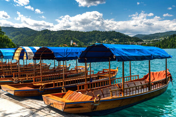 Colorful Wooden Bats on Lake Bled in Slovenia at Summer
