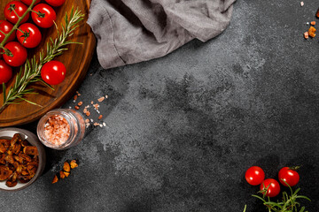 cherry thyme rosemary and pink salt. on black background top  view. Space for text   