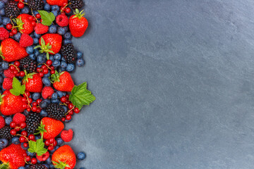 Berries fruits berry fruit strawberries strawberry blueberries blueberry with copyspace copy space on a slate