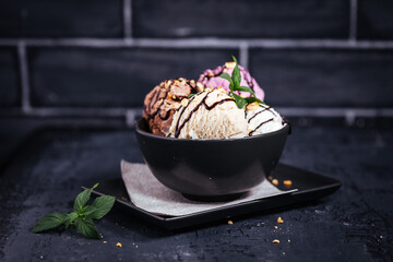 Various type of ice cream on a dark grey background