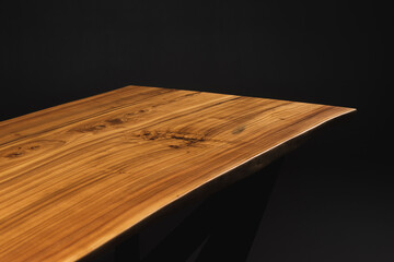 Slab, saw cut wood treated with varnish close-up on a black background. Isolate.
