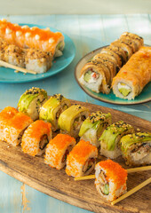 Japanese sushi food. Maki and rolls with tuna, salmon, shrimps, assorted. Selective focus

