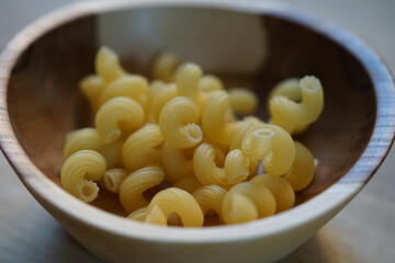 fresh homemade pasta in a wooden bowl