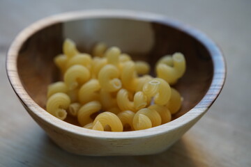 fresh homemade pasta in a wooden bowl