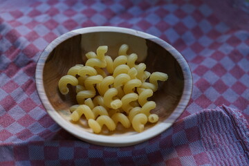 fresh homemade pasta in a wooden bowl