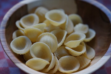 fresh homemade pasta in a wooden bowl