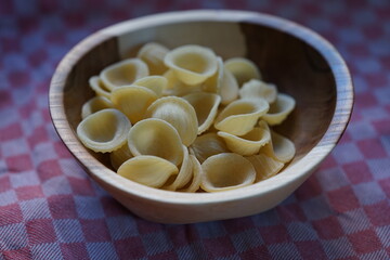 fresh homemade pasta in a wooden bowl