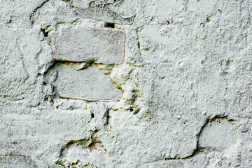 Texture of a brick wall with cracks and scratches which can be used as a background