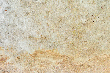 Texture of a concrete wall with cracks and scratches which can be used as a background