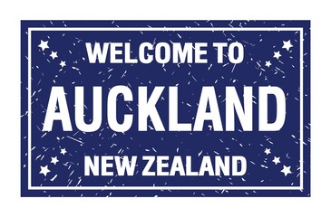 WELCOME TO AUCKLAND - NEW ZEALAND, words written on blue rectangle stamp