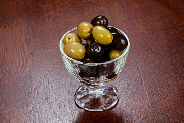 Green and black olives in the bowl