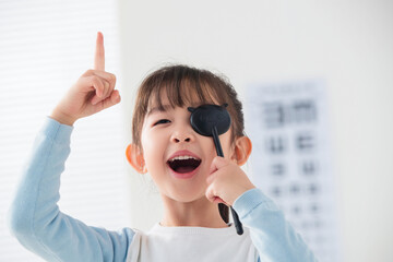 Lovely little girl test visual acuity
