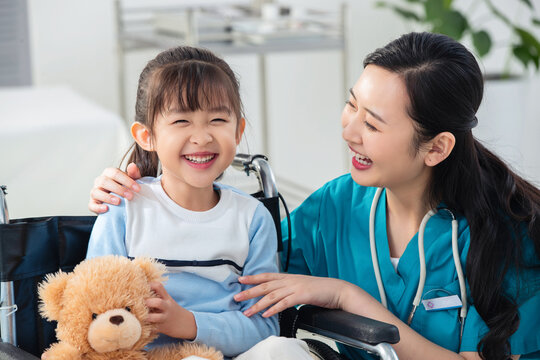 doctor examining little girl with happyness
