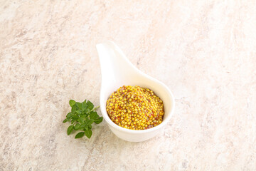 Grain mustard sauce in the bowl