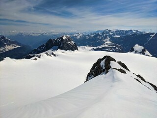 View from summit clariden direction claridenfirn glacier and gamsfairenstock in the Glarus Alps. Ski mountaineering. uri