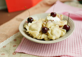 Dumplings. National ukranian dish. Food. Cherry 
