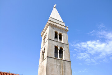 Fototapeta na wymiar Bell tower of Parrish church of the nativity of the virgin at Mali Losinj, Croatia