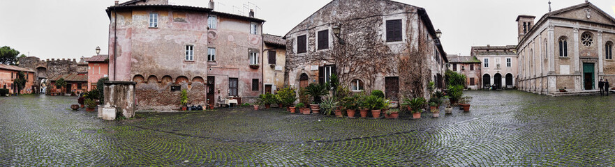 Fototapeta na wymiar Panoramic 180in medieval village of Ostia Antica and Saint' Aurea Cathedral and ancient building