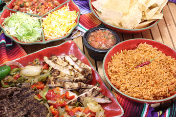 Beef and Chicken Fajita Dinner With Rice and Tortillas in Rustic Setting