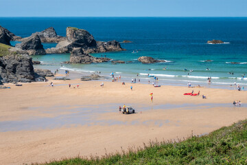 Looking down the beach from the cliffs above Cornwall's Porthcothan bay on beautiful summer's day