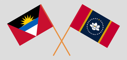 Crossed flags of Antigua and Barbuda and the State of Mississippi. Official colors. Correct proportion