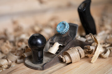 a plane among the shavings on a workbench