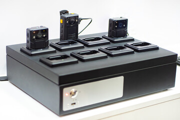 Equipment for charging video recorders. Chest DVR close-up. Equipment for video recording. Close-up...